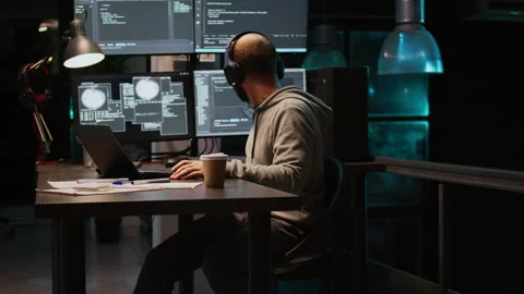 Database programmer writing html code on multiple screens Stock Footage 224580386