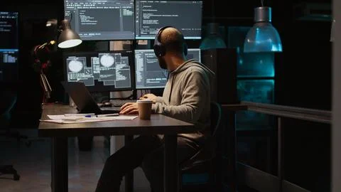 Database programmer writing html code on multiple screens Stock Photos