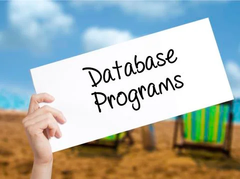 Database Programs Sign on white paper. Man Hand Holding Paper with text. Isol Foto stock