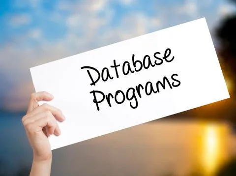 Database Programs Sign on white paper. Man Hand Holding Paper with text. Isol Foto stock