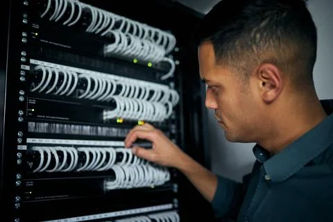 Database, server room and engineer with man for maintenance, programmer and Stock Photos