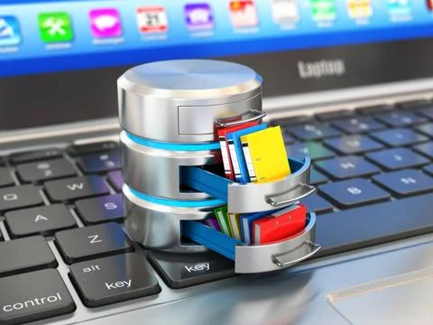 Database storage concept. Hard disk icon with folders on laptop keyboard. ... Foto stock