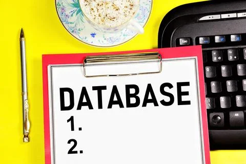 Database. A text label in a working notebook. Stock Photos