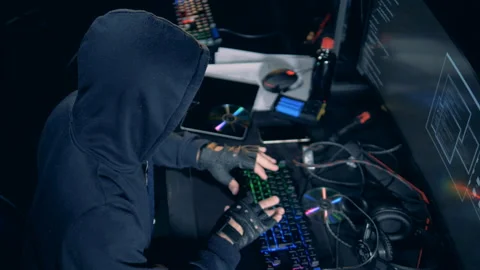 Databases are getting broken into by a male hacker Video stock 104206782