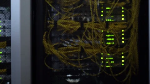 Datacenter. Flashing server rack rows of green lamps. Blurred background. 動画素材 115963647