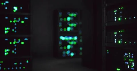 Datacenter interior with illuminated servers in a dark environment Illustrazione stock