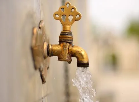 Date of ablution tap made ​​of brass Foto stock