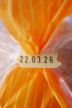 Date code on packaging for baked goods seen up close Stock-Fotos