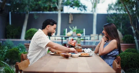 Date, engagement ring and proposal with couple in restaurant together for Stock Footage 321126652