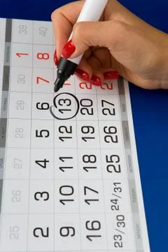 Date Friday 13 is marked on the calendar. Stock Photos