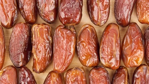 Date fruit laid out on board, slide to right. Stock Footage 136040419