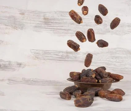 Date fruit Ramazan concept image. Dropping, falling, flying, raining. Stock Photos