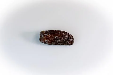 Date. one date. dried dates close-up on a white background. sweet date Stock Photos