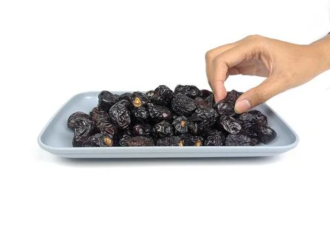 Date palm fruit with insulated hands on a white background. Food graphics Stock Photos