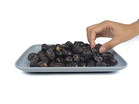 Date palm fruit with insulated hands on a white background. Food graphics Stock Photos
