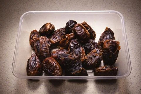 Date Palms in Plastic Container Stock Photos