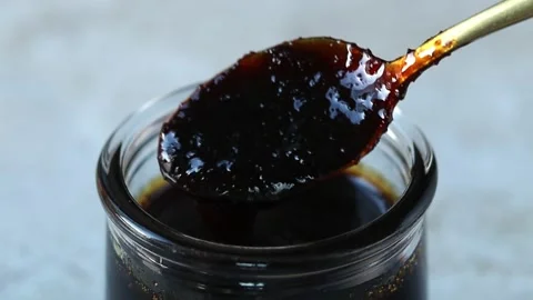 Date syrup closeup Stockbeeldmateriaal 234439361