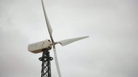 Up-to-date wind generator closeup, cloudy grey sky bg Video stock 97101264