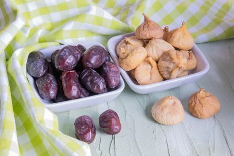 Dates and figs are on the table. Stock Photos