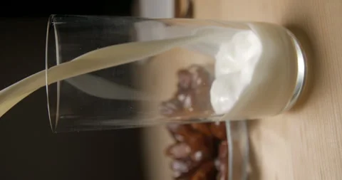 Dates and milk pouring slow-motion, breaking fast during ramadan, studio Video stock 264858593