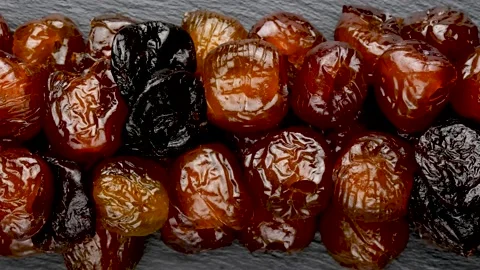 Dates and prunes on a black background. Stock Footage 139152621