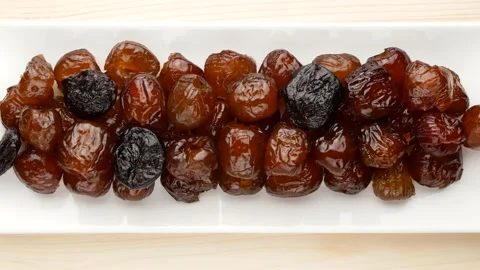 Dates and prunes on a plate. Dried fruits. Stock Footage 137766561