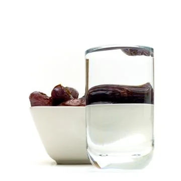 Dates and water for ramadan Stock Photos