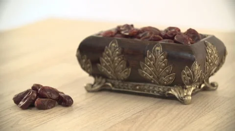 Dates in antique container. Stock Footage 54484815