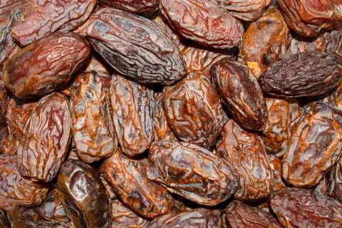 Dates background. Fresh arabic dates. Dried date fruit texture. Stock Photos