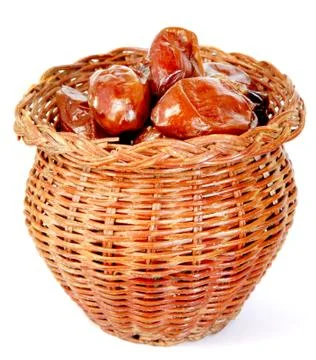 Dates in the bamboo jar on white background Stock Photos