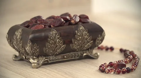 Dates container and prayer beads. Stock Footage 54484751