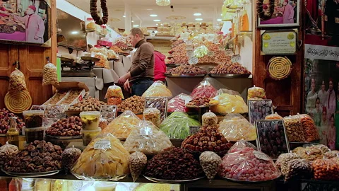 Dates, figs, nuts and dried fruits stall in old medina, Fes, Morocco Video stock 305404352