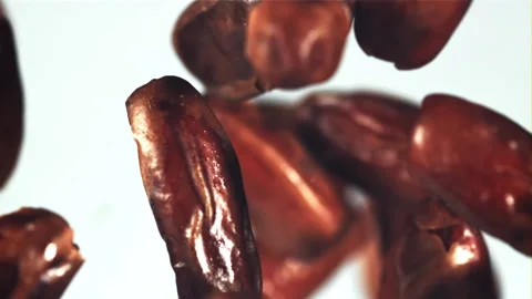 Dates fly up and rotate in flight. Filmed is slow motion 1000 fps. Video stock 202140656