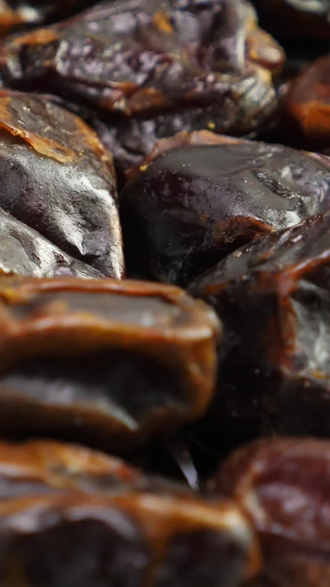 Dates fruit background. Dried date, closeup. Nobody. Top view. Rotate. Vertical Stock Footage 327176586