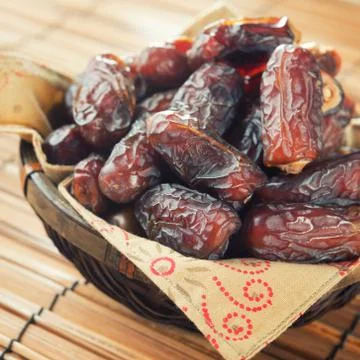 Dates fruit in basket. Stock Photos