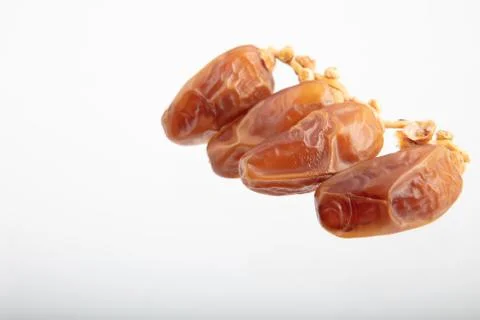 Dates fruit branch on white background Stock Photos