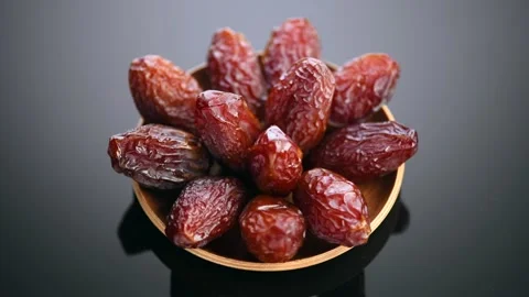 Dates fruit. Date fruits with reflection on black background. Medjool dates Stock Footage 314160668