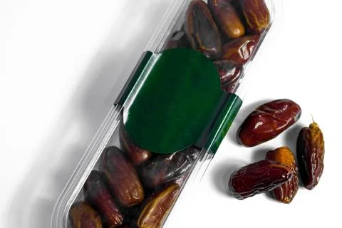 Dates fruit in plastick package with blank green label for product mockup Stock Photos