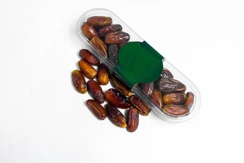 Dates fruit in plastick package with blank green label for product mockup Stock Photos