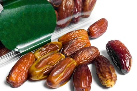 Dates fruit in plastick package with blank green label for product mockup Stock Photos