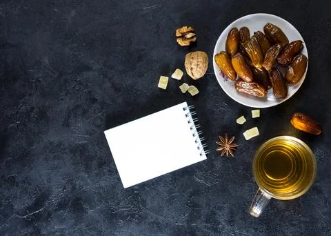 Dates fruit plate with notepad tea 写真素材