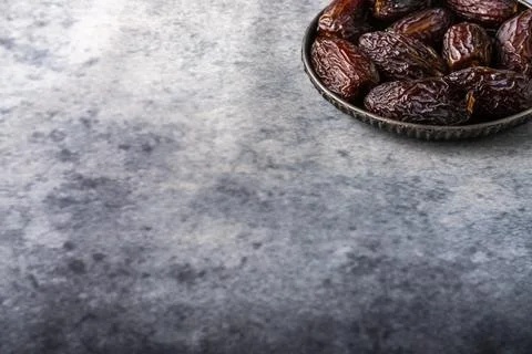 Dates in an iron plate. Stock Photos