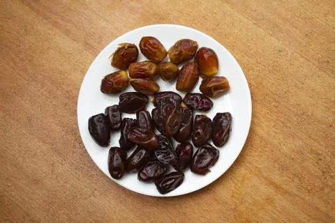 Dates isolated on a plate Stock Photos