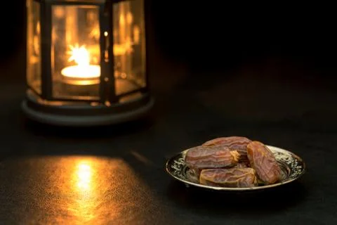 Dates with lantern background with yellow light Stock Photos
