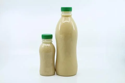 Dates milkshake served in bottle isolated on background side view of health.. Foto stock