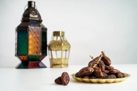 Dates palm and arabic lantern on white Stock Photos