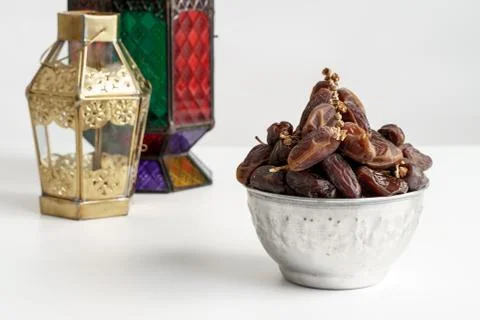 Dates palm and arabic lantern on white Stock Photos