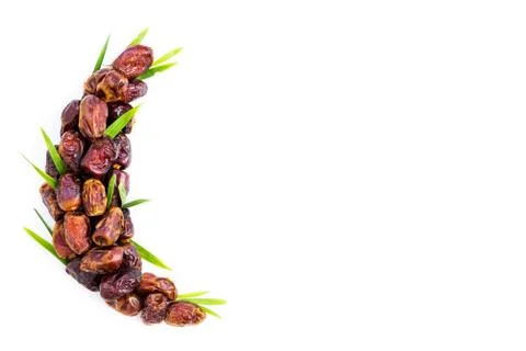 Dates palm fruit arranged in shape of crescent moon. Ramadan kareem. 스톡 사진