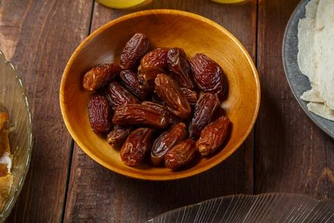 Dates in a plate on the festive table of Ramadan Iftar Stock Photos