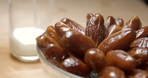 Dates rotating with milk, breaking fast during ramadan, studio 4K Video stock 264858978
